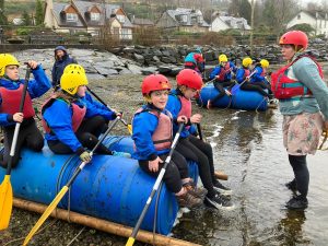 school children rowing