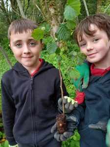 school children in the woods